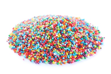 Photo of Pile of colorful sprinkles on white background. Confectionery decor