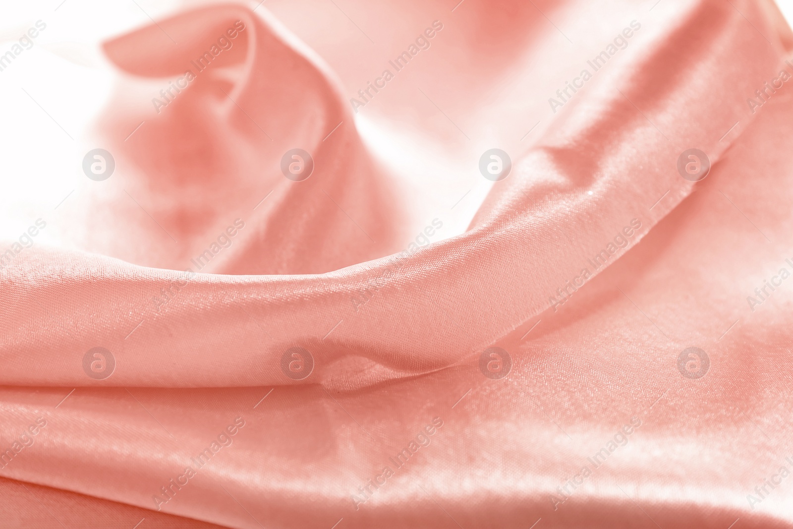 Photo of Texture of rose gold silk as background