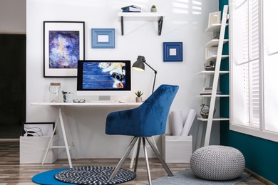 Photo of Home workplace with modern computer and desk in room