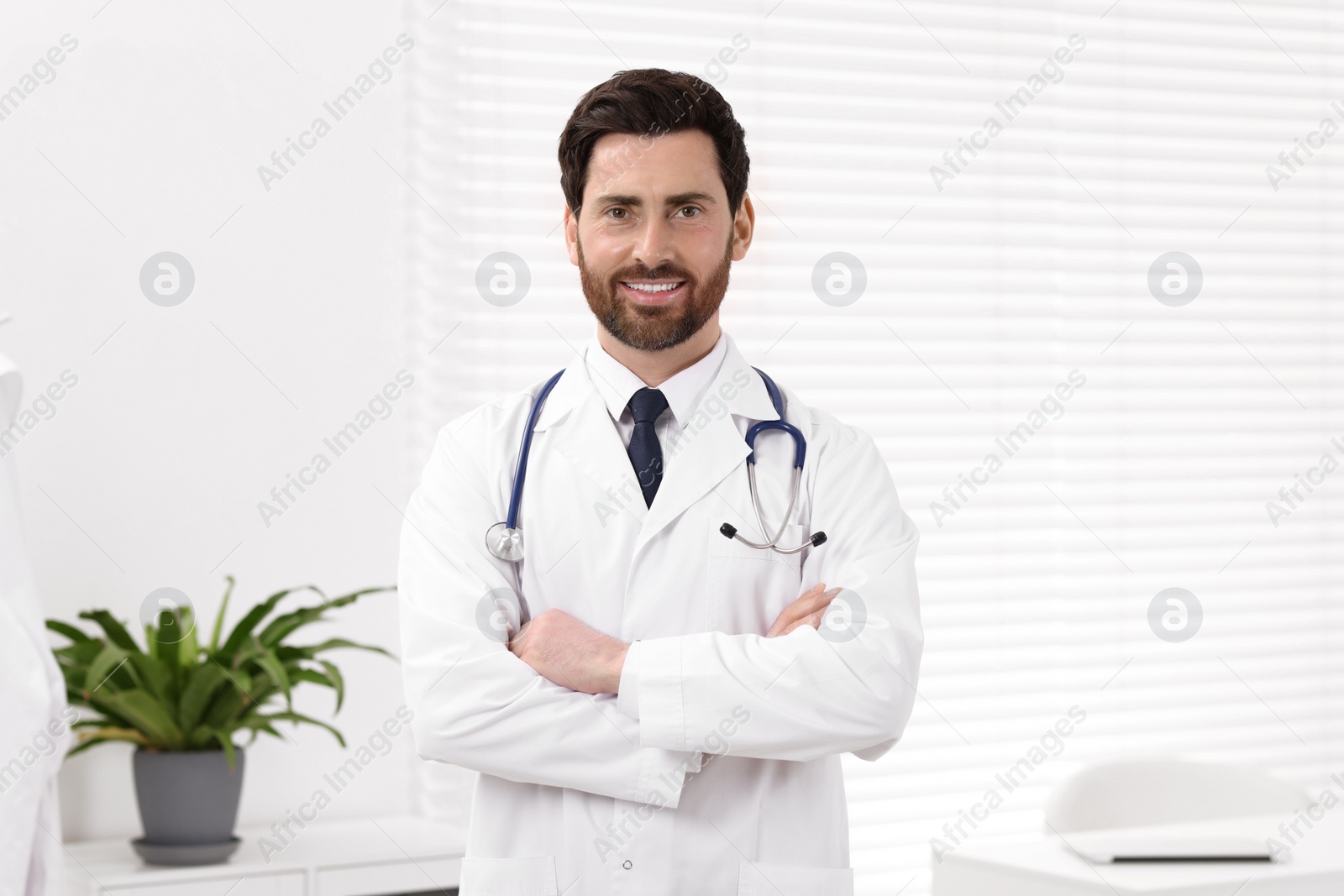 Photo of Portrait of medical consultant with stethoscope in clinic