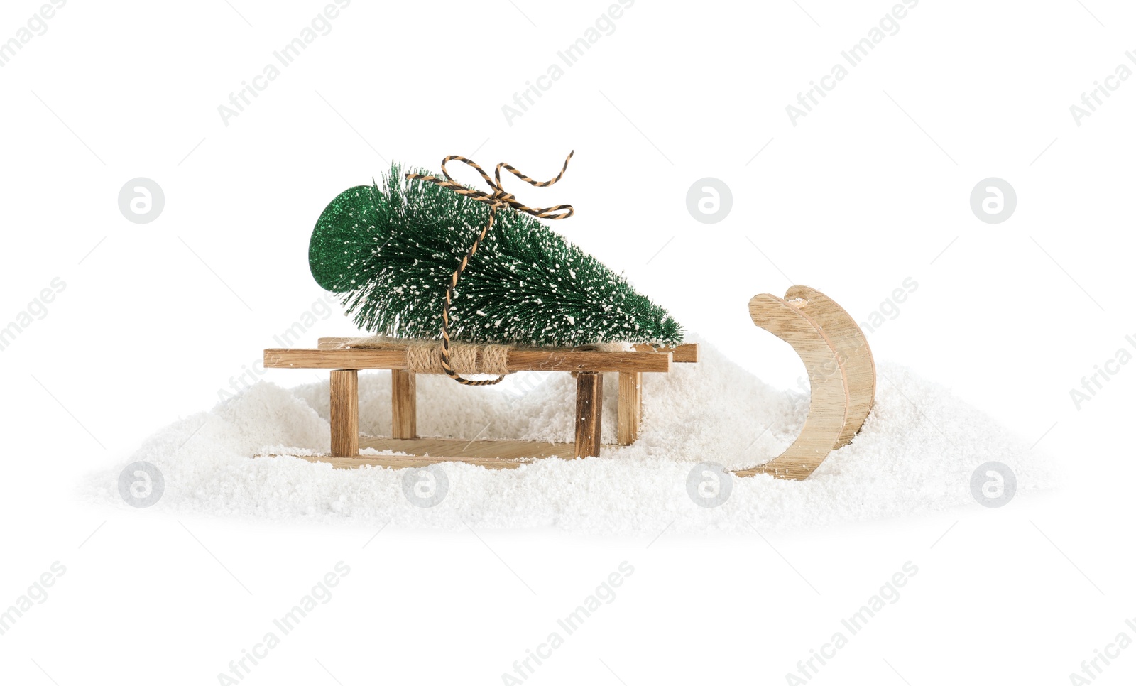 Photo of Sleigh with decorative Christmas tree on white background