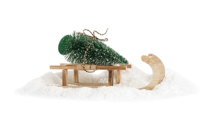 Photo of Sleigh with decorative Christmas tree on white background