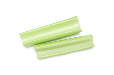 Photo of Fresh green cut celery isolated on white, top view