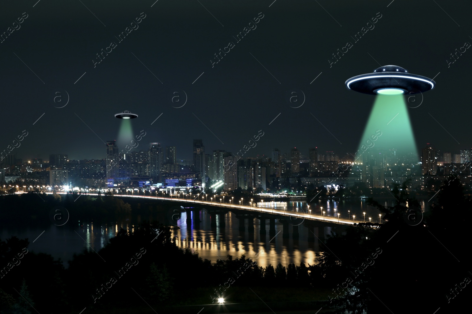 Image of UFO. Alien spaceships emitting light beams over night city