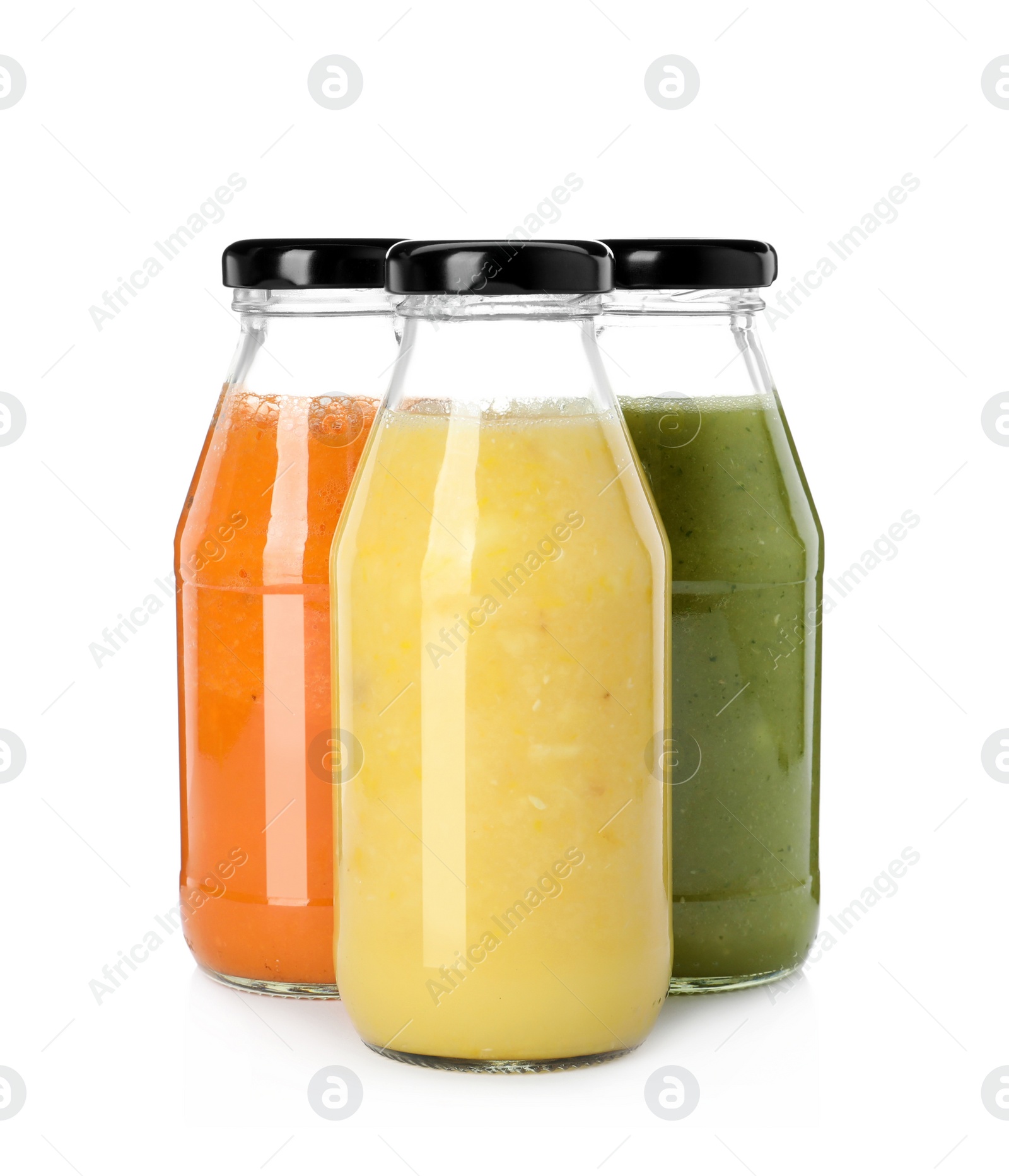 Photo of Bottles of fresh juices on white background