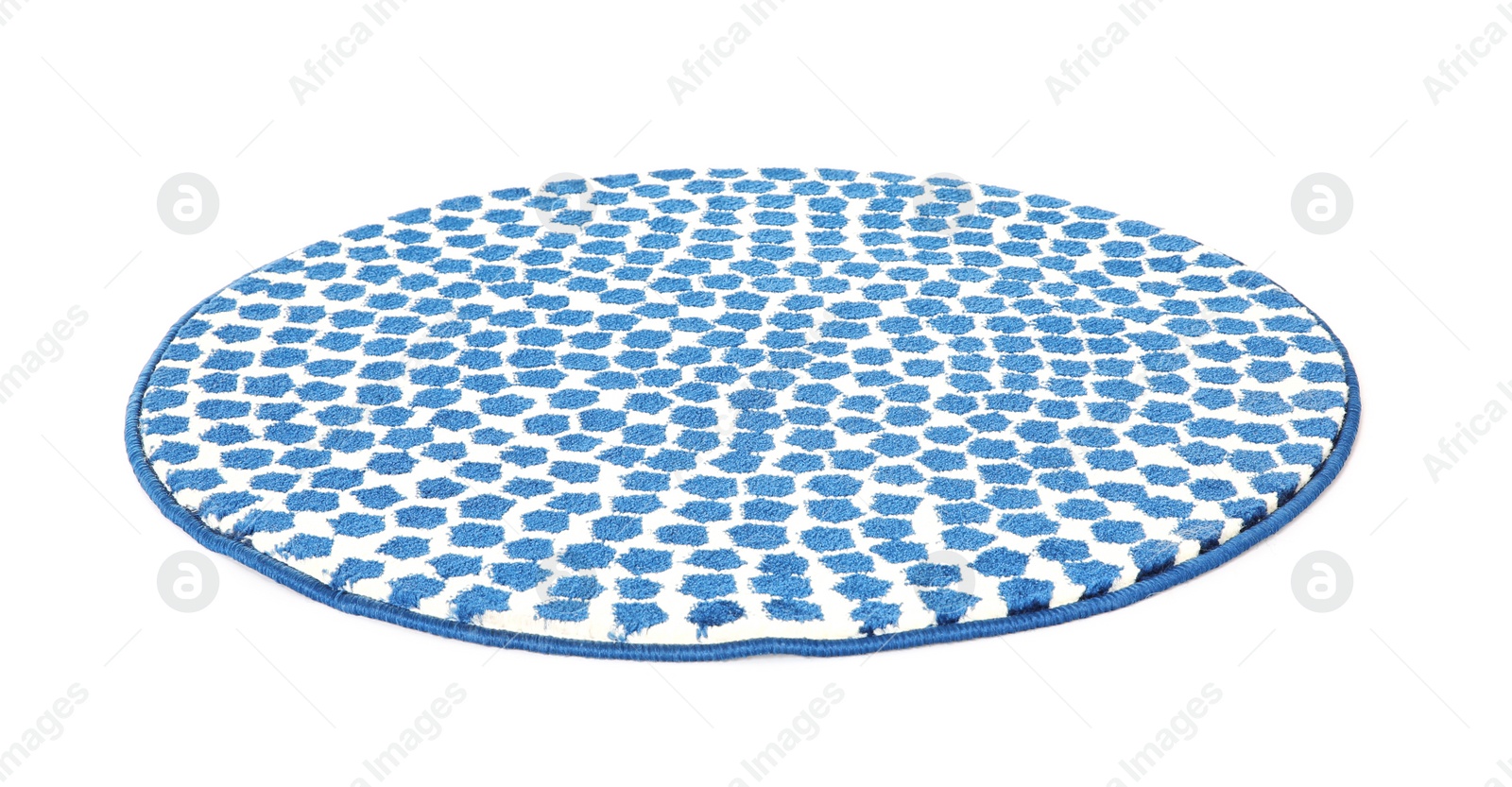 Photo of Round spotted carpet on white background