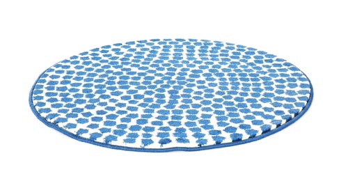 Round spotted carpet on white background