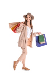 Photo of Young woman with shopping bags on white background