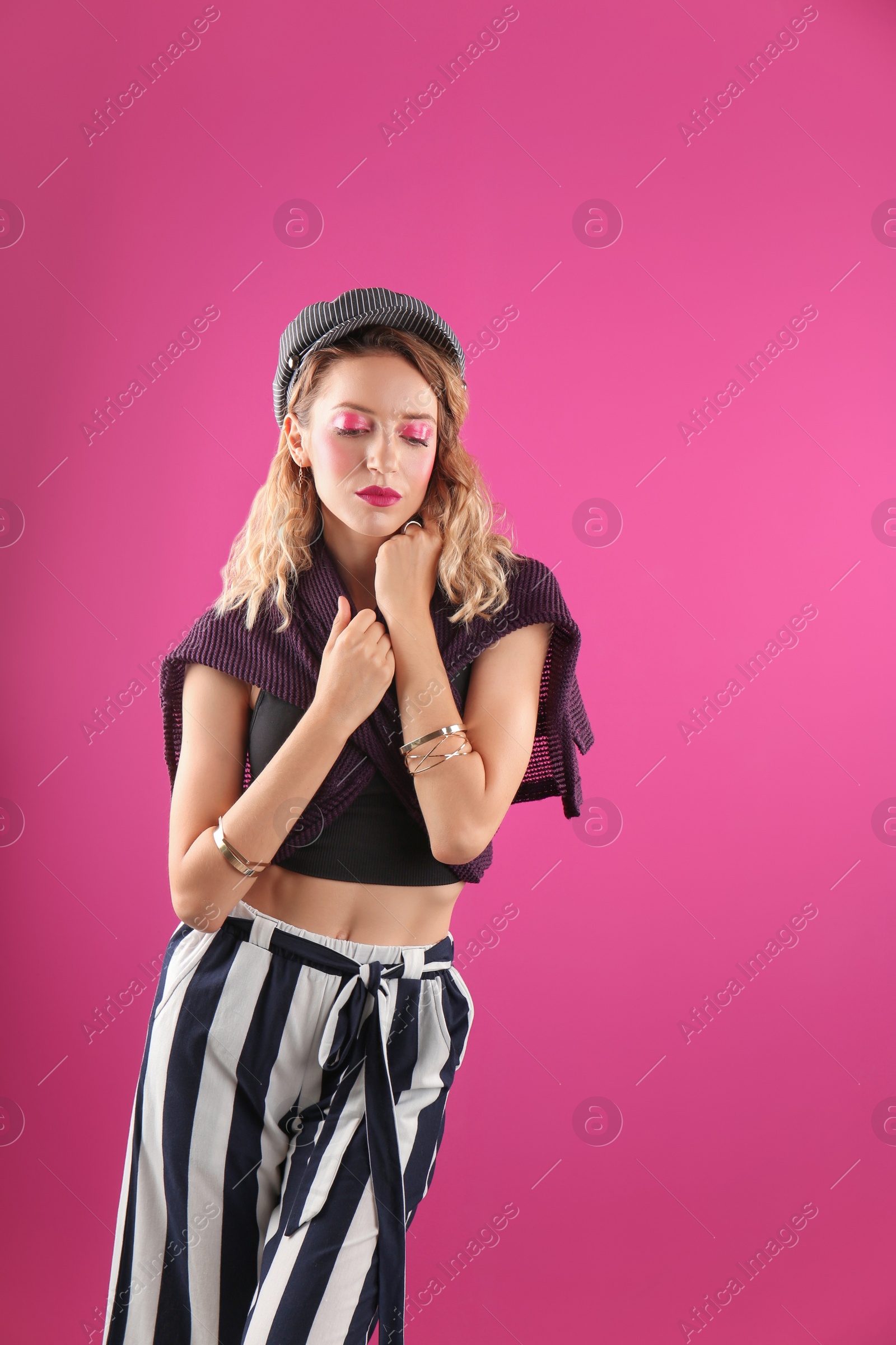 Photo of Beautiful young woman posing on color background. Summer fashion