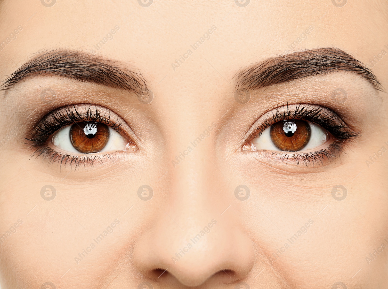 Photo of Young woman, closeup of eyes. Visiting ophthalmologist