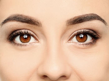 Photo of Young woman, closeup of eyes. Visiting ophthalmologist