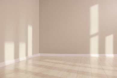 Photo of Light and shadows from window on floor and walls indoors