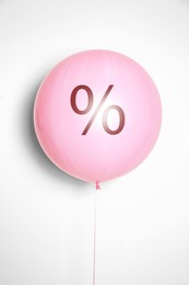 Image of Discount offer. Pink balloon with percent sign on white background