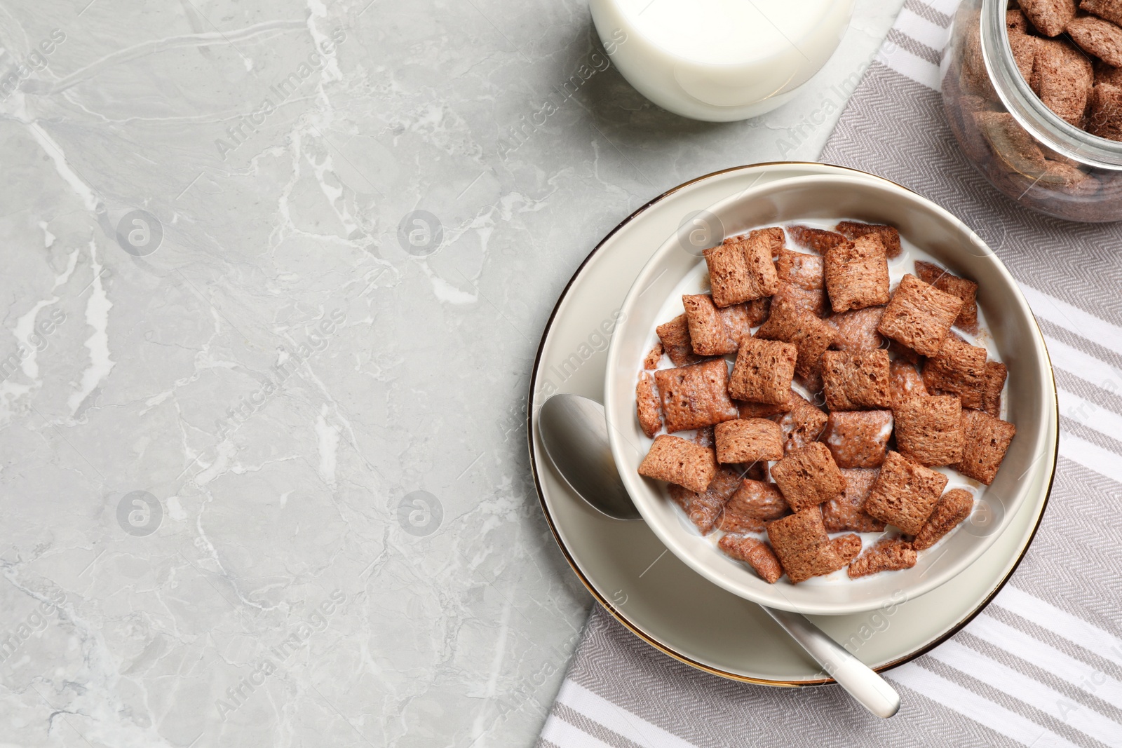 Photo of Tasty corn pads with milk served on light grey marble table, flat lay. Space for text