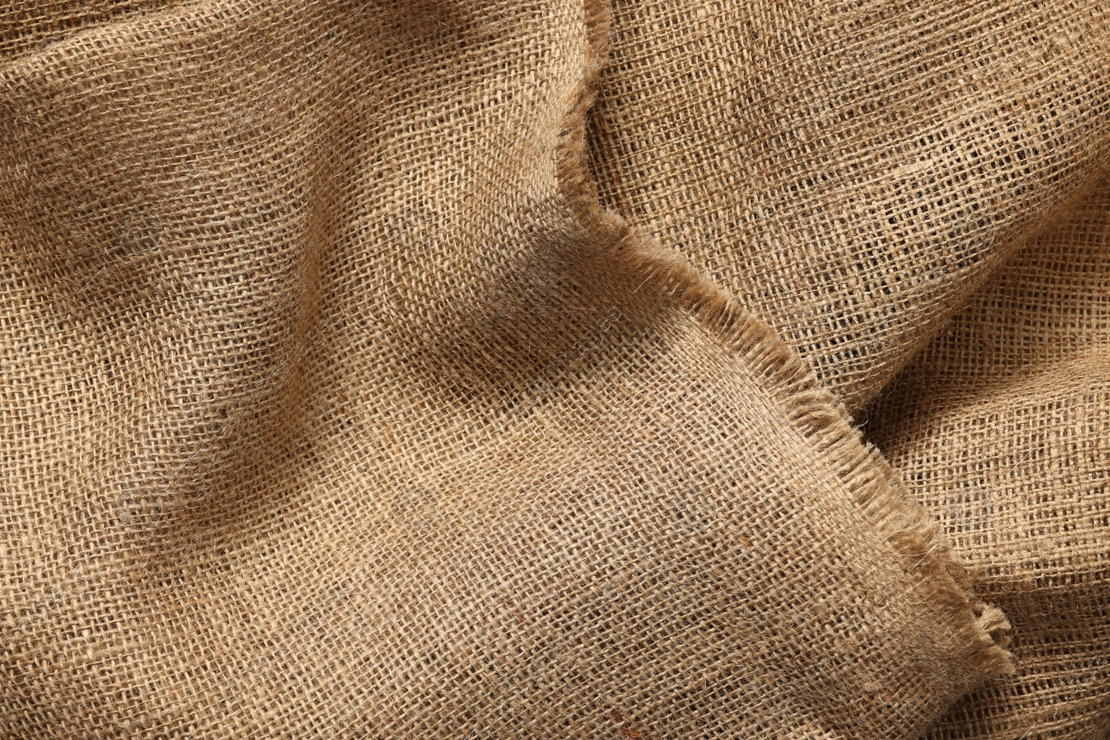 Photo of Texture of burlap fabric as background, top view