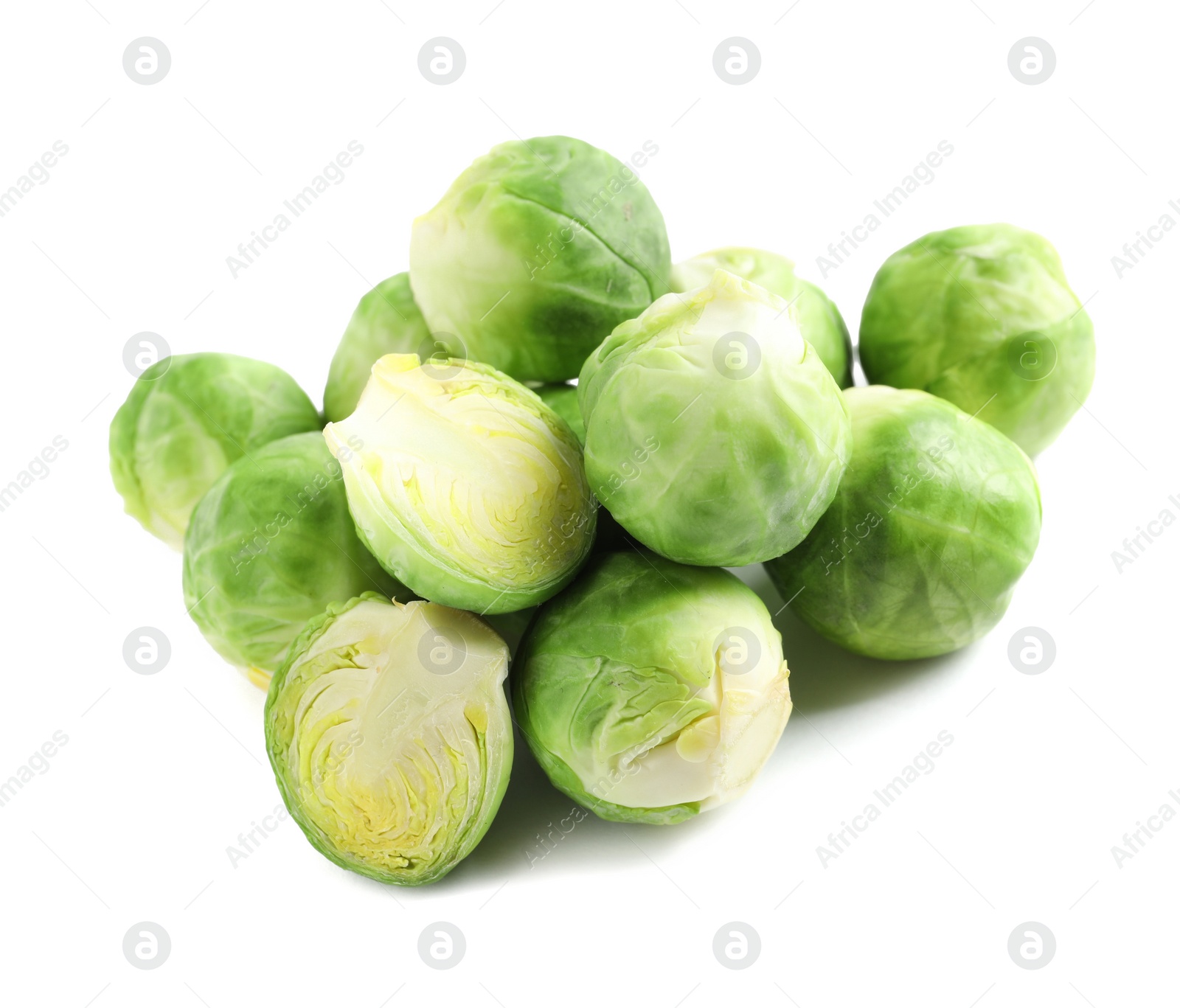 Photo of Pile of fresh Brussels sprouts isolated on white