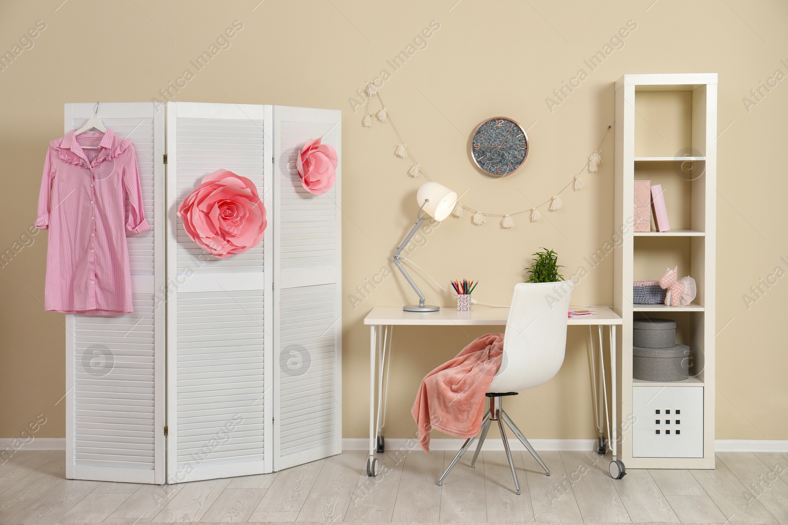 Photo of Cozy child room interior with study station and modern decor elements