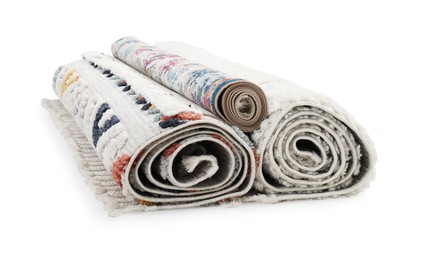 Photo of Rolled carpets on white background. Interior element