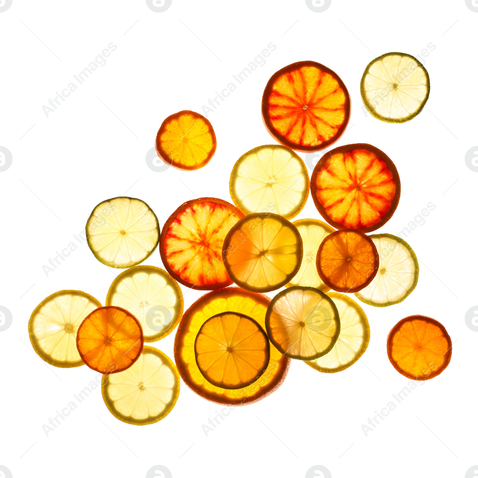 Photo of Illuminated slices of citrus fruits on white background, top view