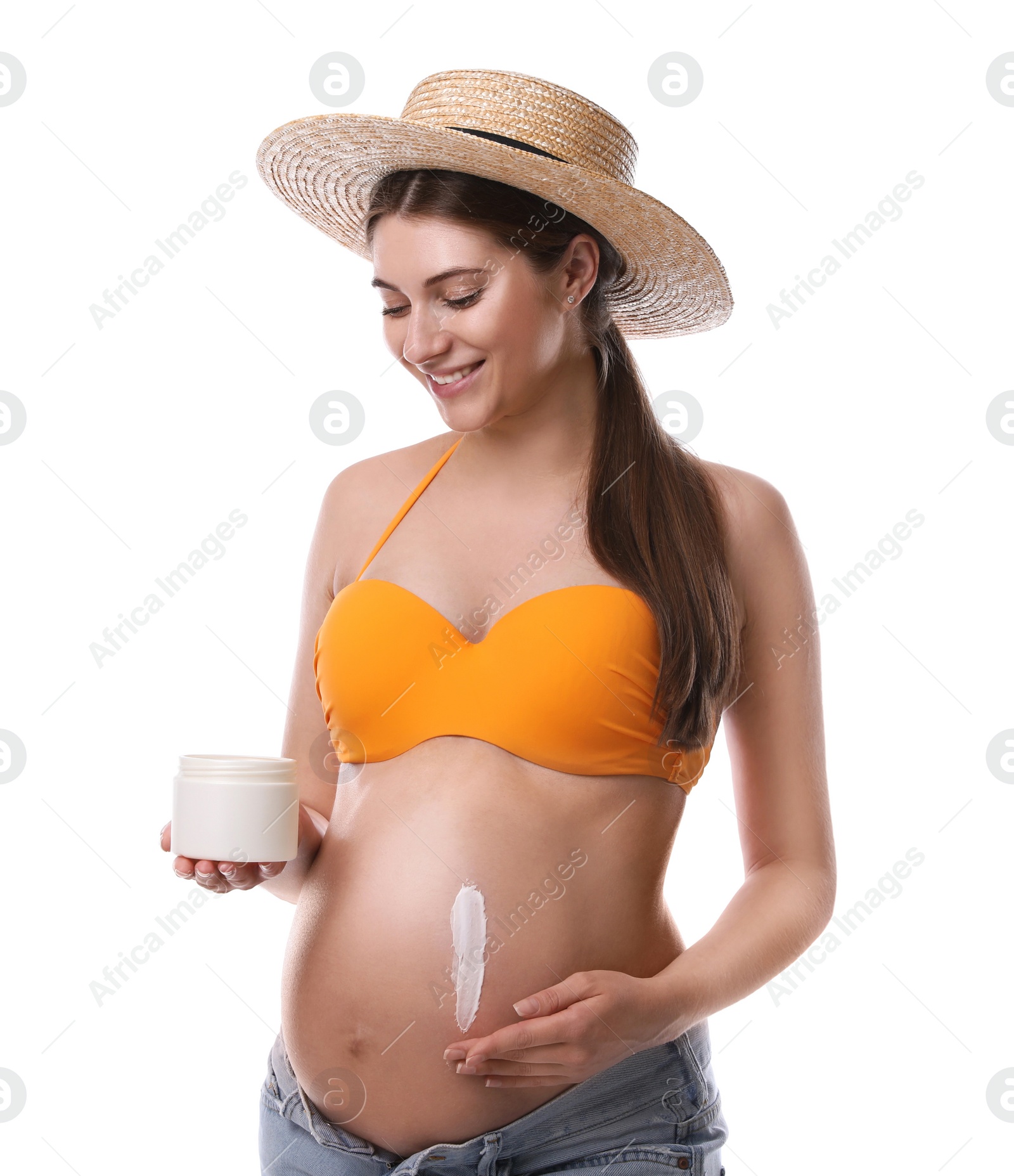 Photo of Young pregnant woman with sun protection cream on white background