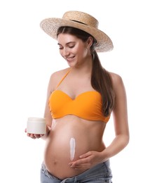 Young pregnant woman with sun protection cream on white background