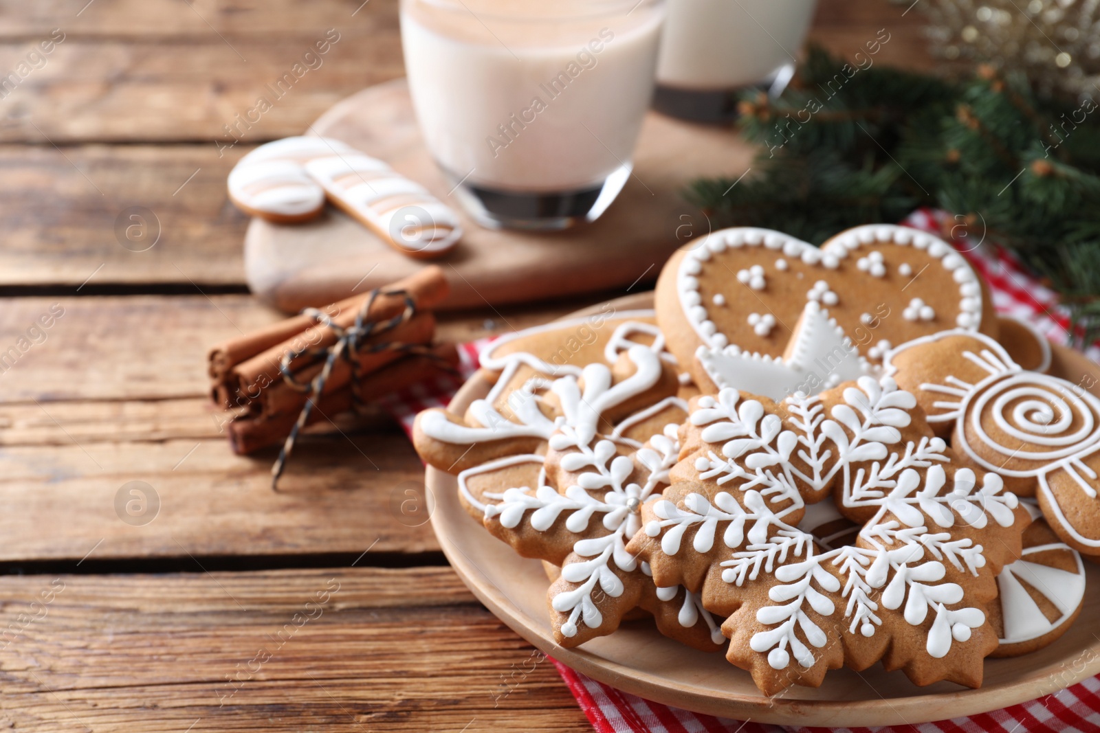 Photo of Delicious gingerbread Christmas cookies on wooden table, closeup