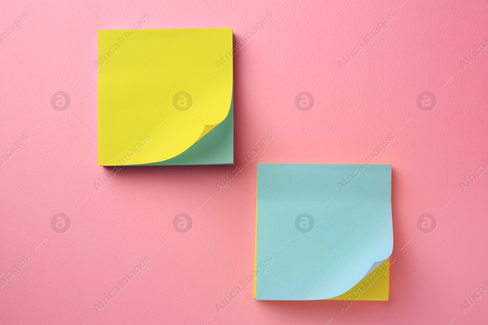 Photo of Blank paper notes on pink background, flat lay