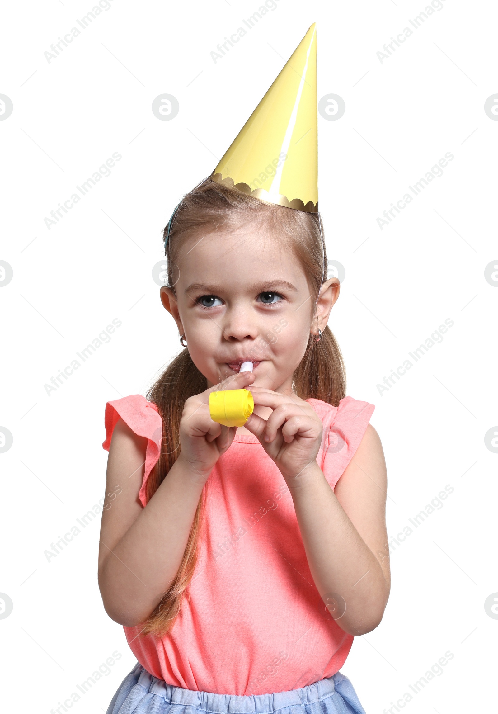 Photo of Birthday celebration. Cute little girl in party hat with blower on white background