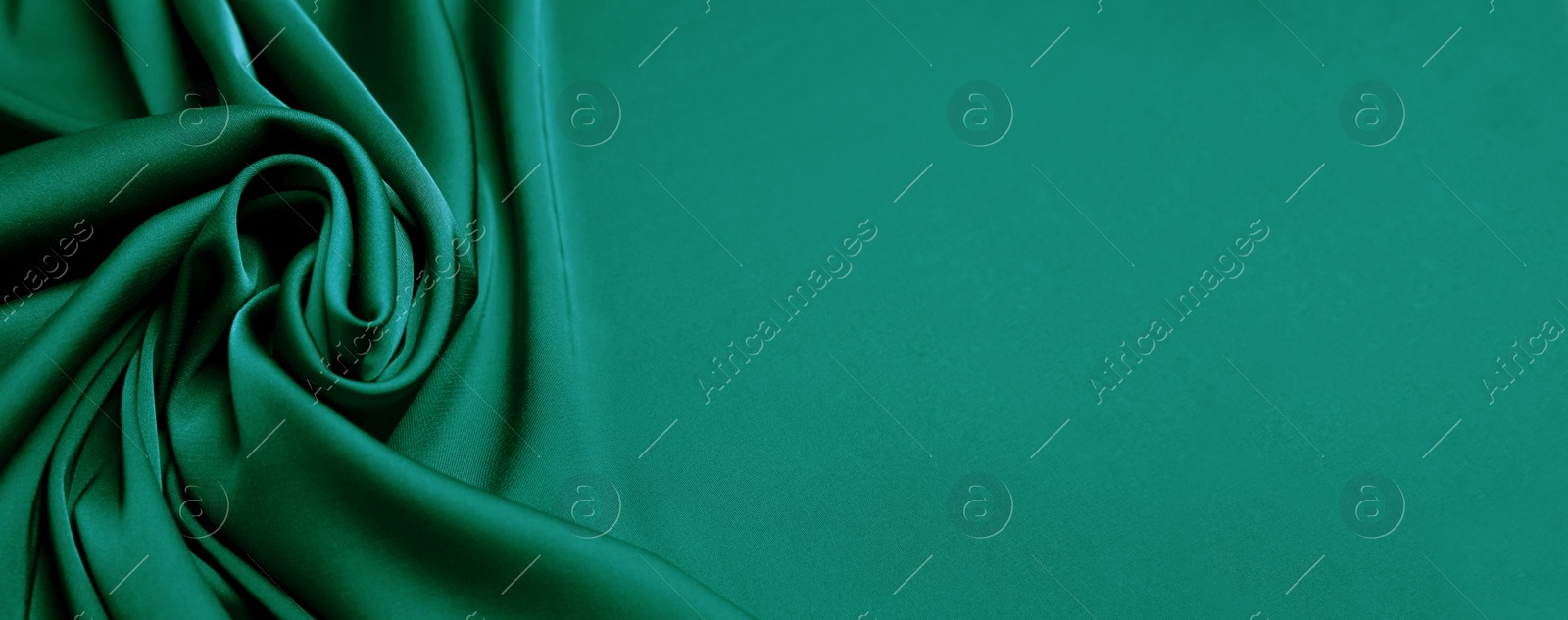 Image of Green silk fabric as background, top view with space for text. Banner design