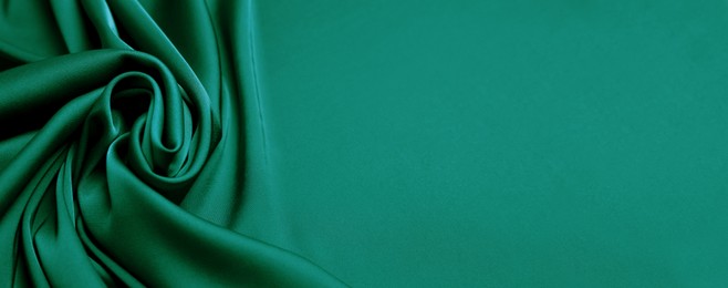 Image of Green silk fabric as background, top view with space for text. Banner design