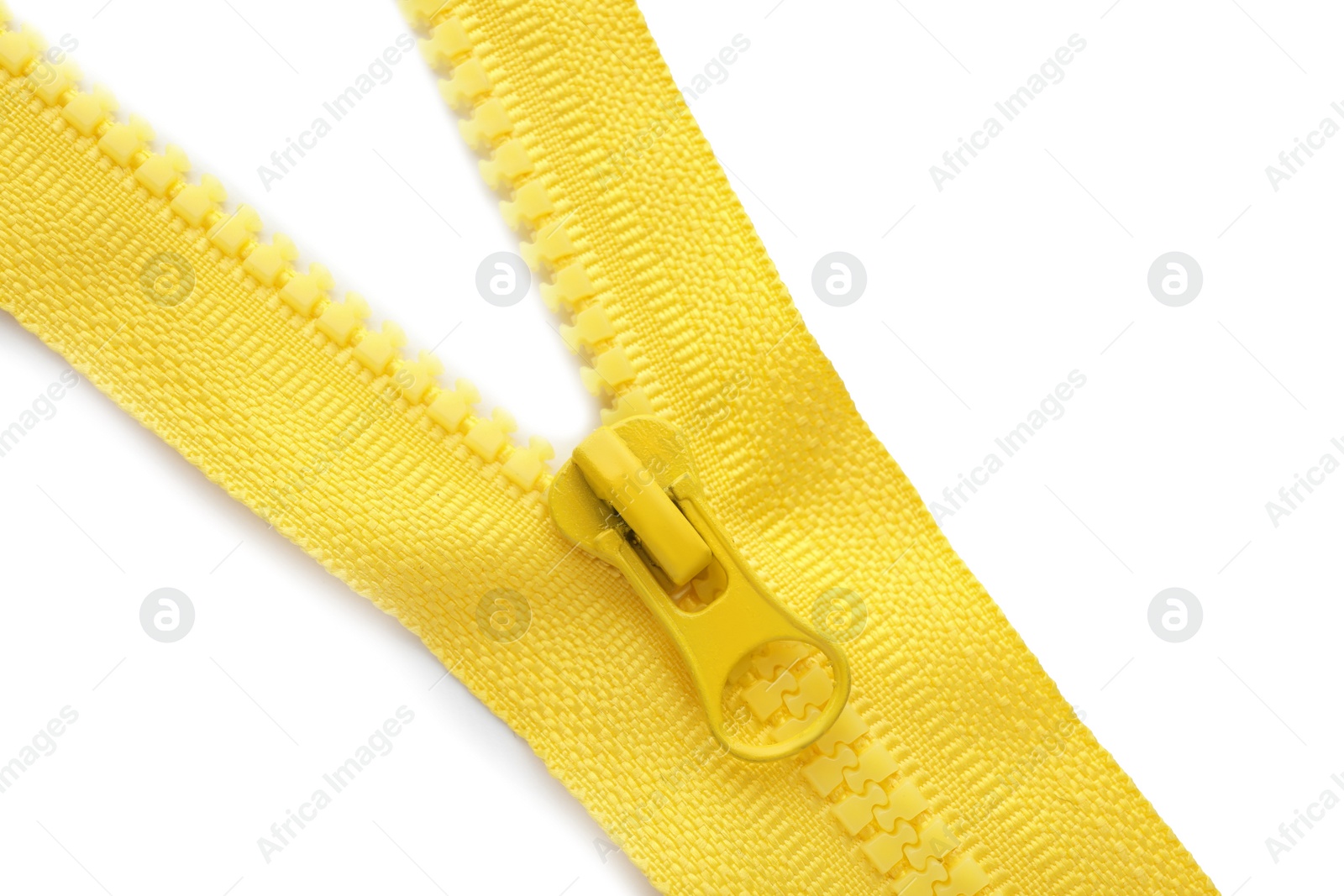 Photo of Yellow zipper on white background, top view