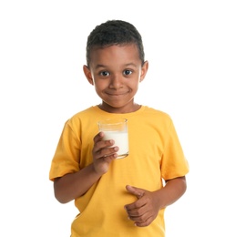 Photo of Adorable African-American boy with glass of milk on white background