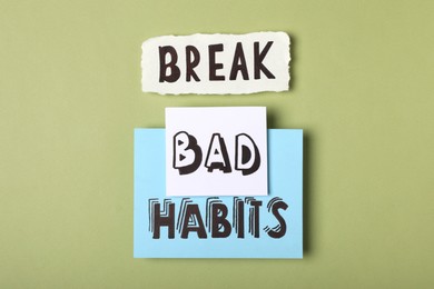 Photo of Flat lay composition with phrase Break Bad Habits on green background
