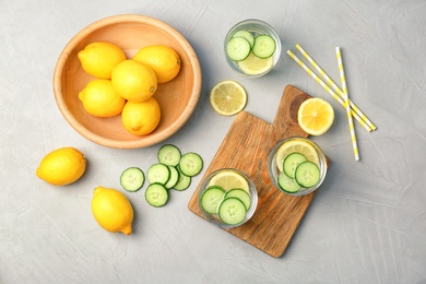 Flat lay composition with delicious natural lemonade on light background