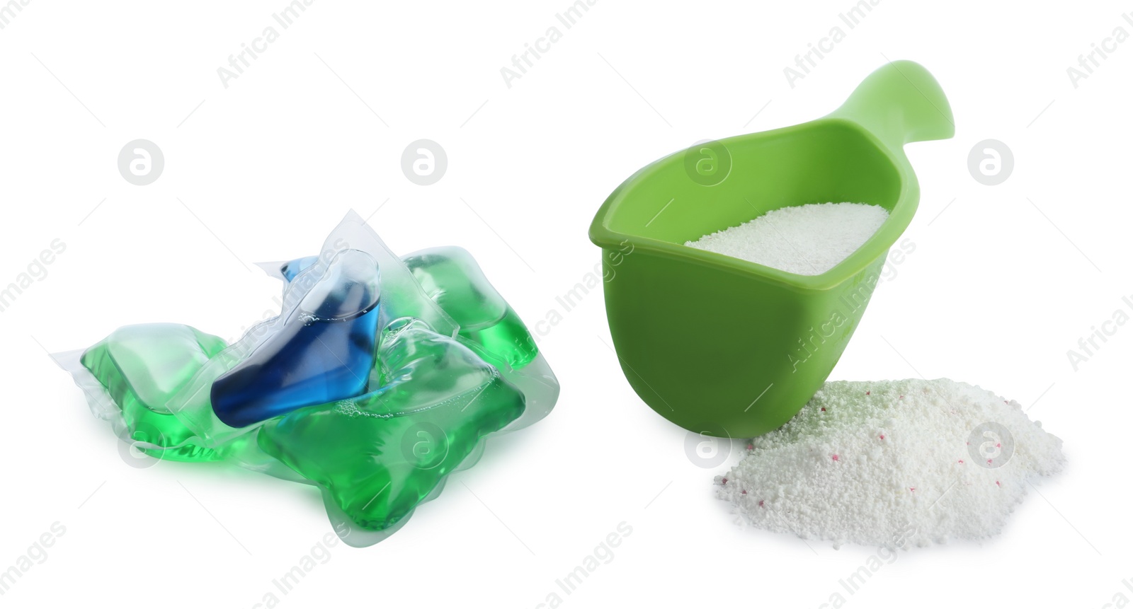 Photo of Laundry capsules and measuring scoop of washing powder on white background