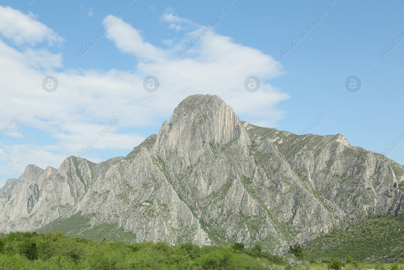 Photo of Picturesque landscape with high mountains under blue sky outdoors