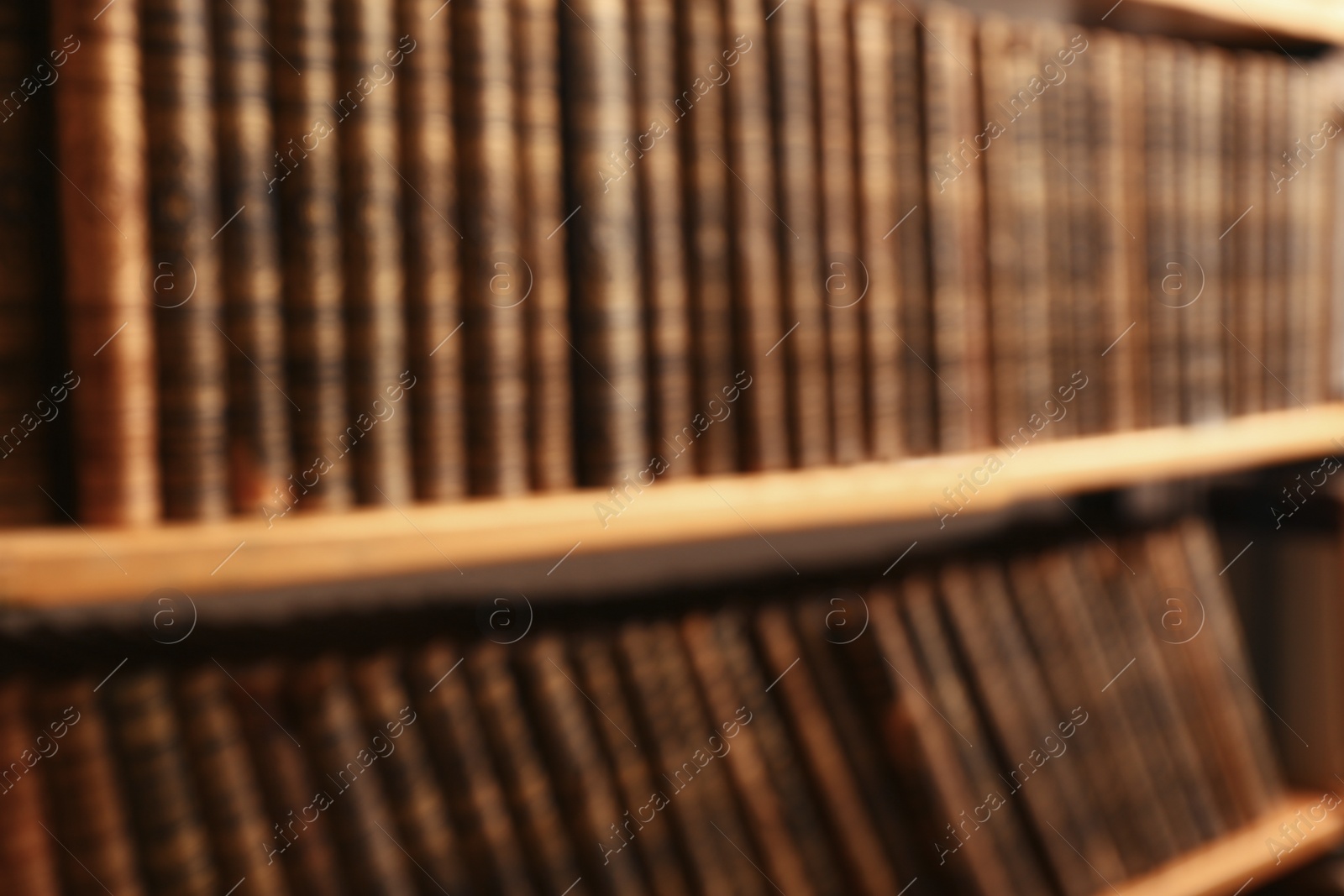 Photo of Blurred view of books on shelves in library