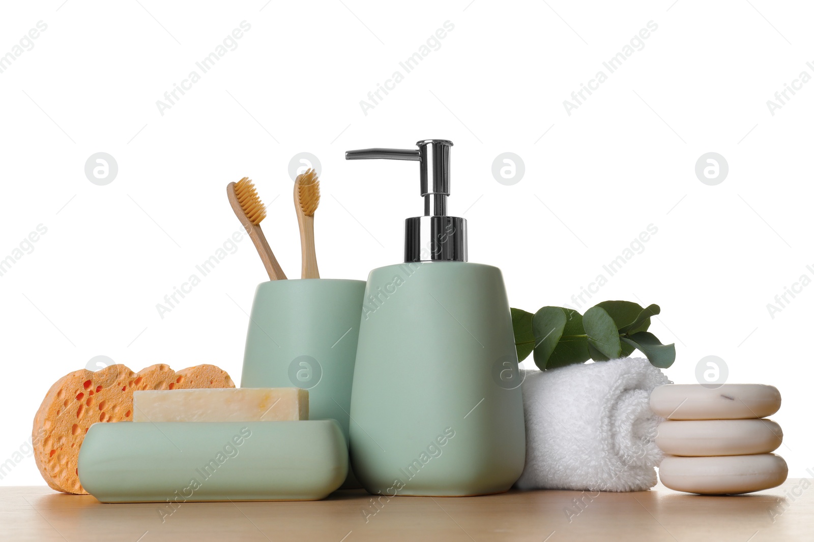 Photo of Bath accessories. Different personal care products and eucalyptus branch on wooden table against white background