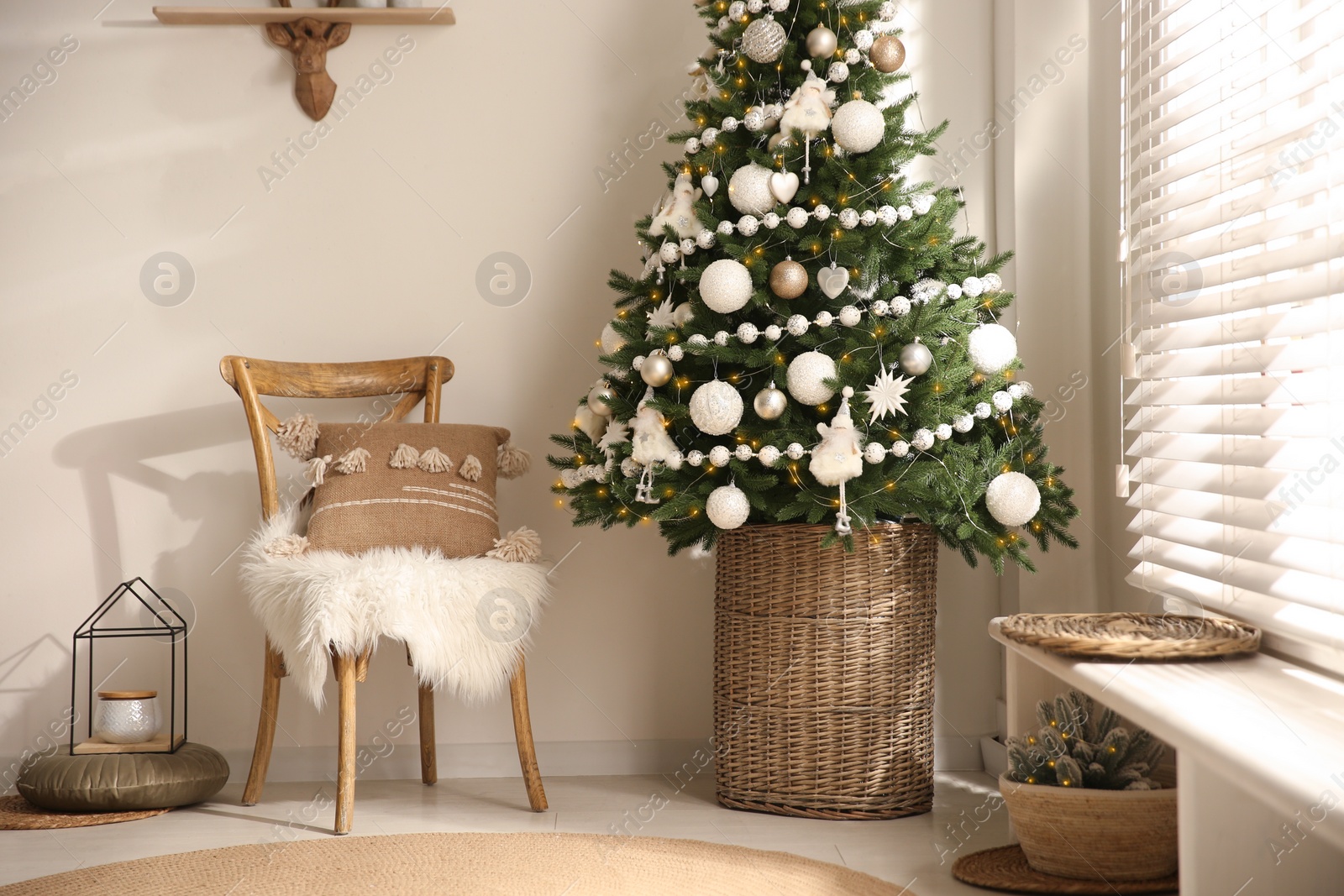 Photo of Beautiful decorated Christmas tree in festive room interior