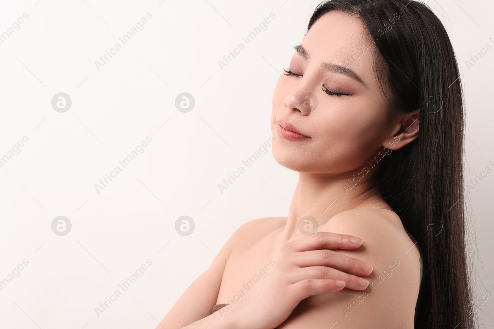 Photo of Portrait of beautiful woman on white background