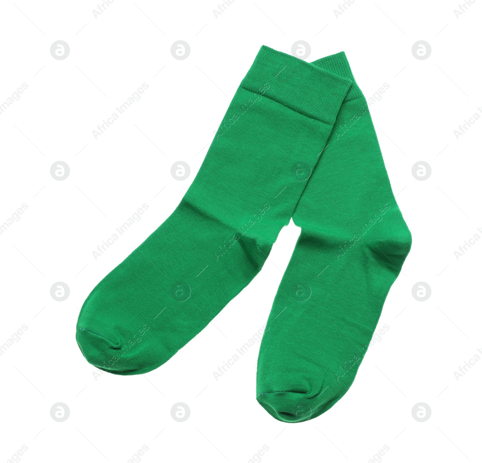 Photo of Green socks on white background, top view