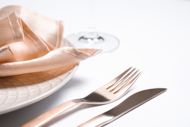 Stylish table setting on white background, closeup