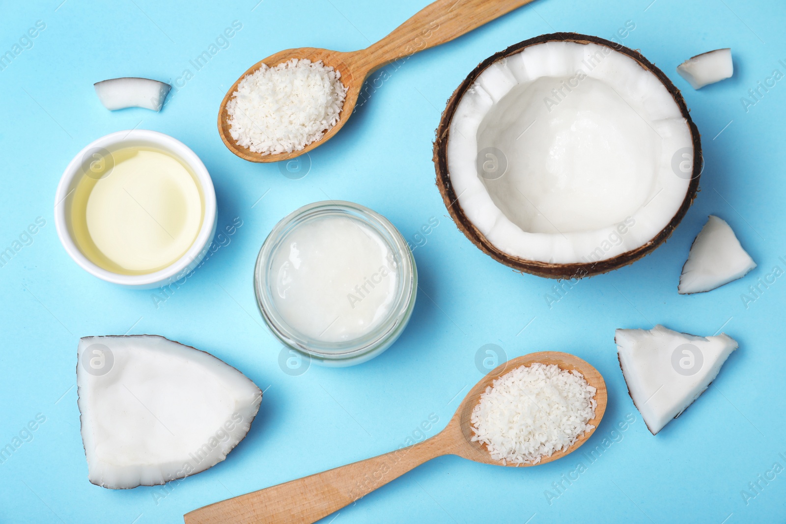 Photo of Flat lay composition with natural organic coconut oil on color background