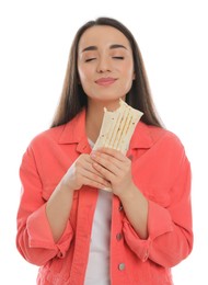 Young woman eating tasty shawarma isolated on white