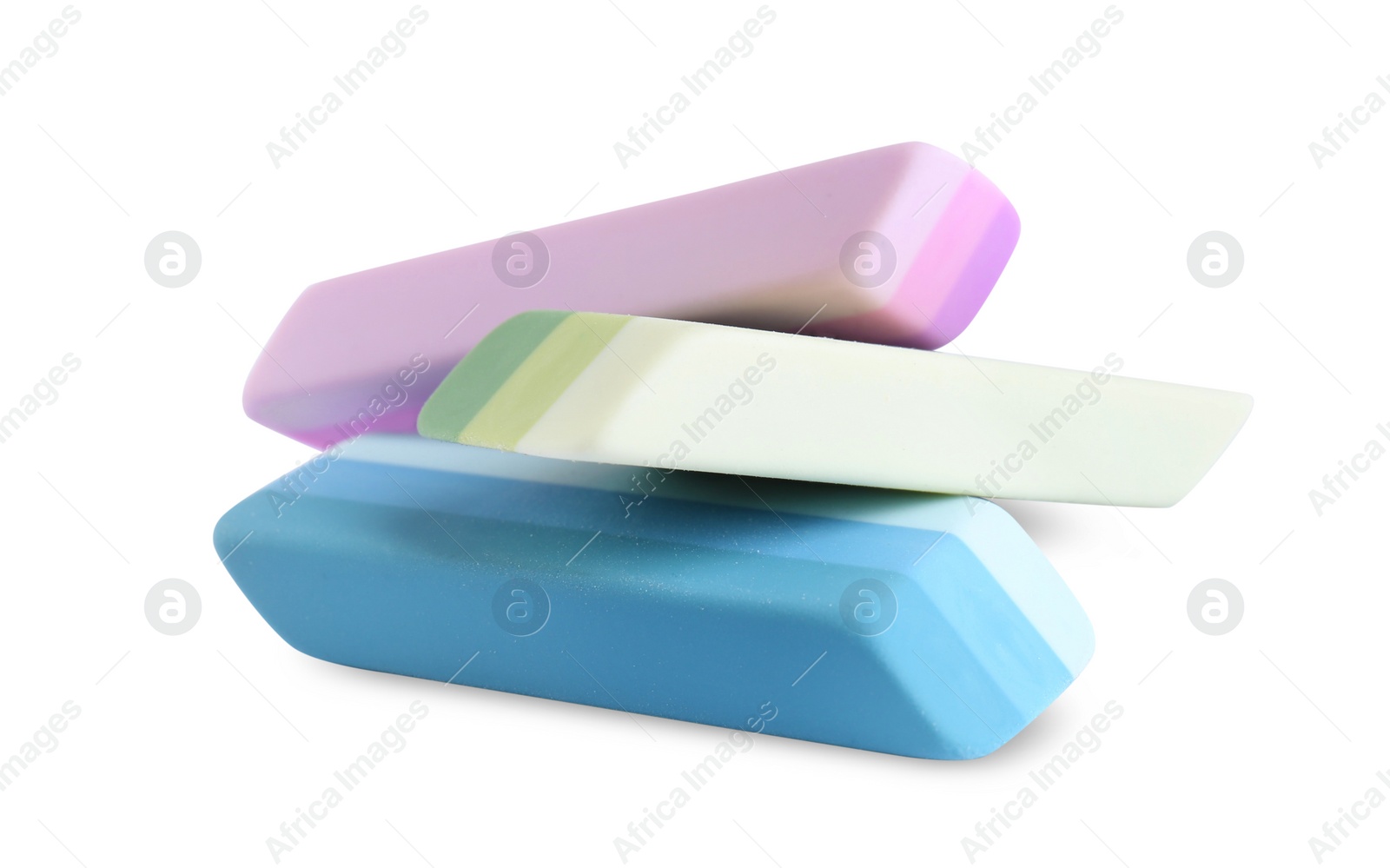 Photo of New bright erasers isolated on white. School stationery