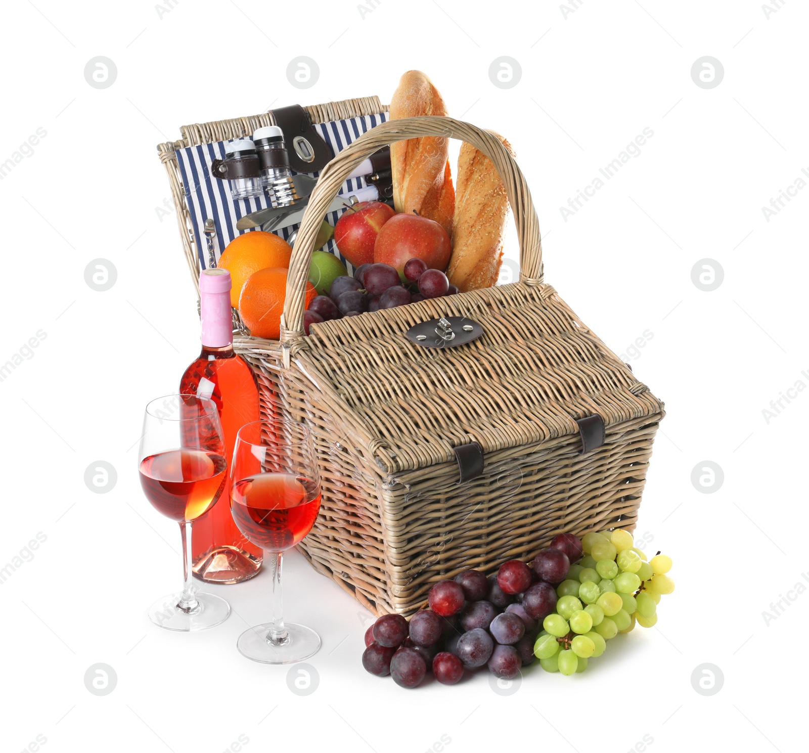 Photo of Wicker picnic basket with different products on white background