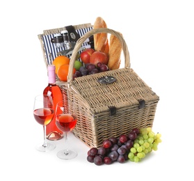 Photo of Wicker picnic basket with different products on white background