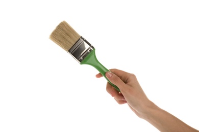 Photo of Woman holding paint brush on white background, closeup