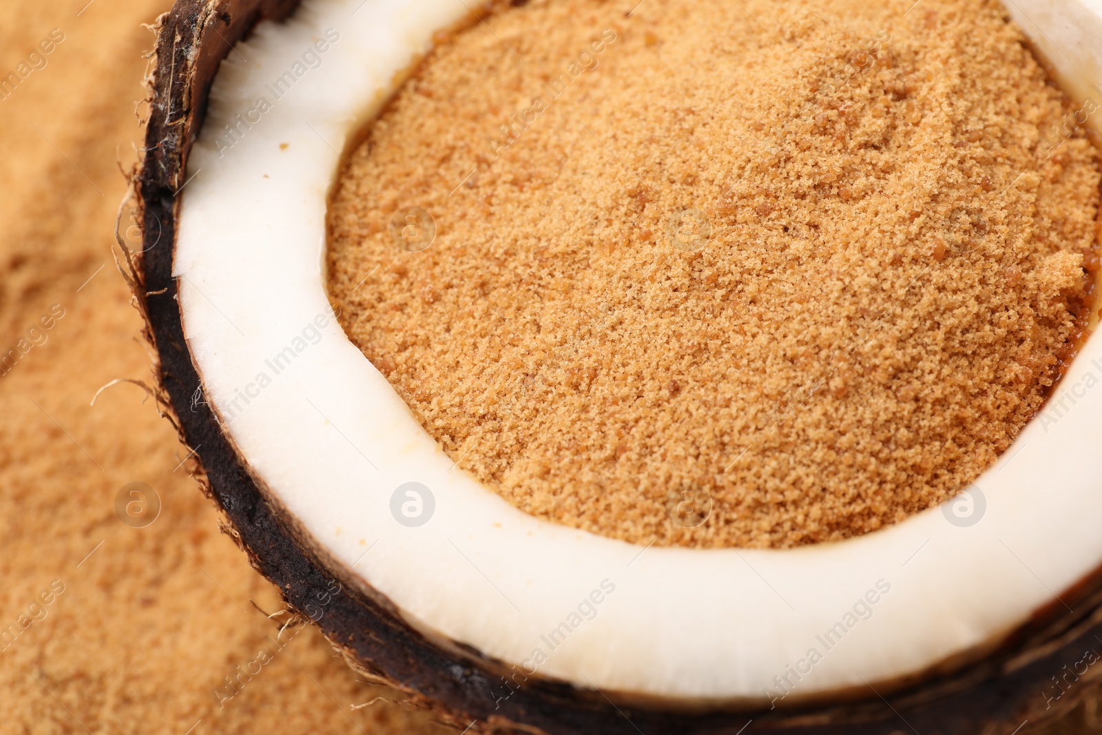 Photo of Coconut sugar and fruit on table, closeup