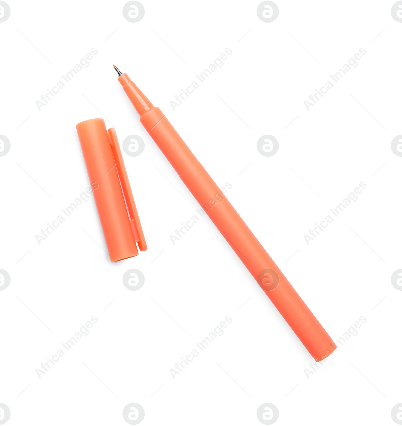 Photo of One orange marker and cap on white background, top view